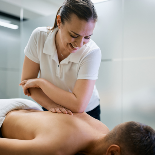 Massage therapist massaging a client
