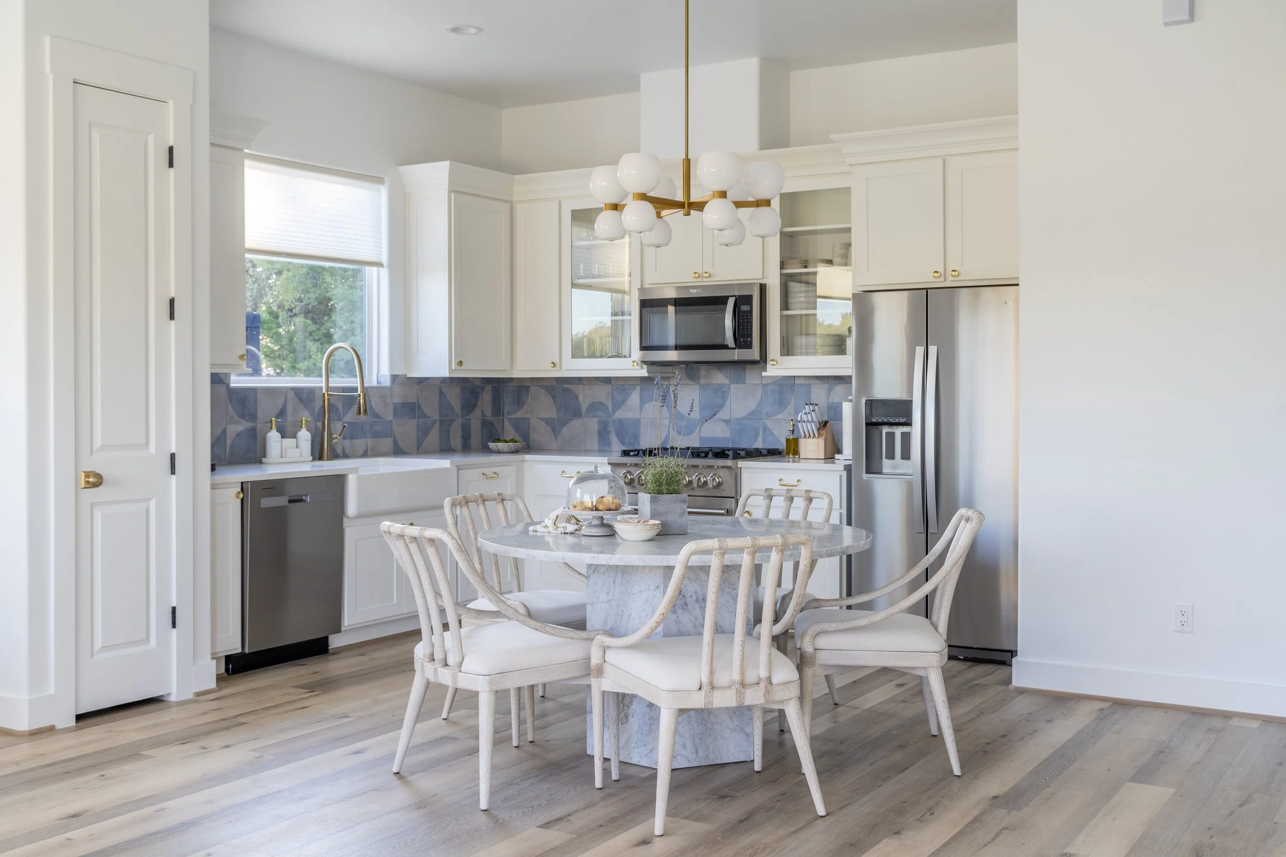 The kitchen and dining area inside the Air Retreat at Element Ranch in Round Top, TX blends modern luxury with rustic charm