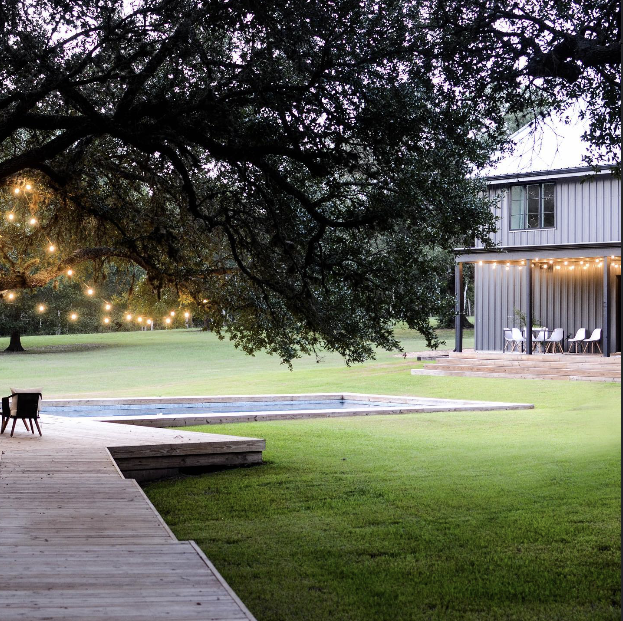 Stunning living and dining space filled with natural light at the Rancho Olivos Barndo in Round Top, Texas