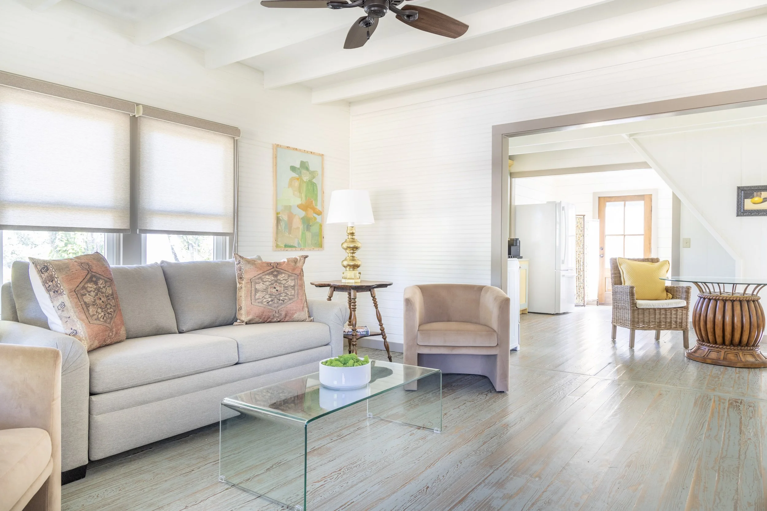 Spacious living room with wood floors at The Meme cottage at the Round Top Motel