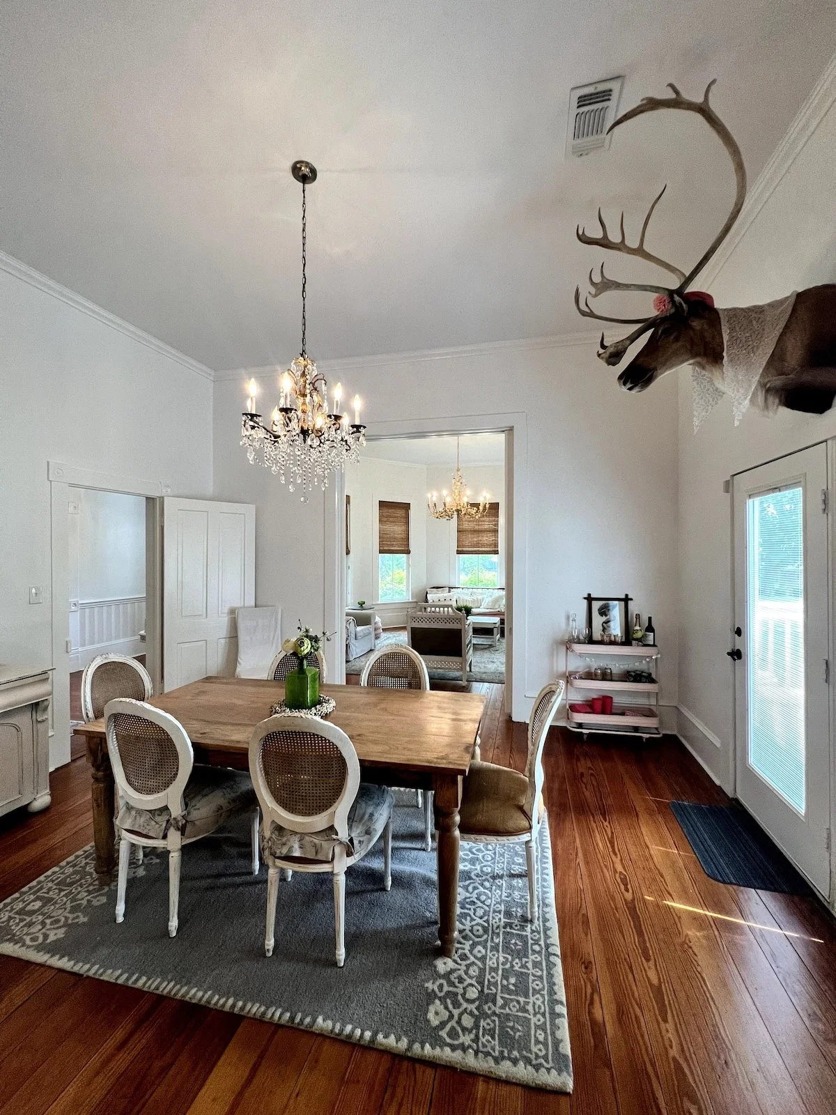 The dining room inside The Pink Peacock, a charming, vintage cottage from the early 1900s in Burton, TX