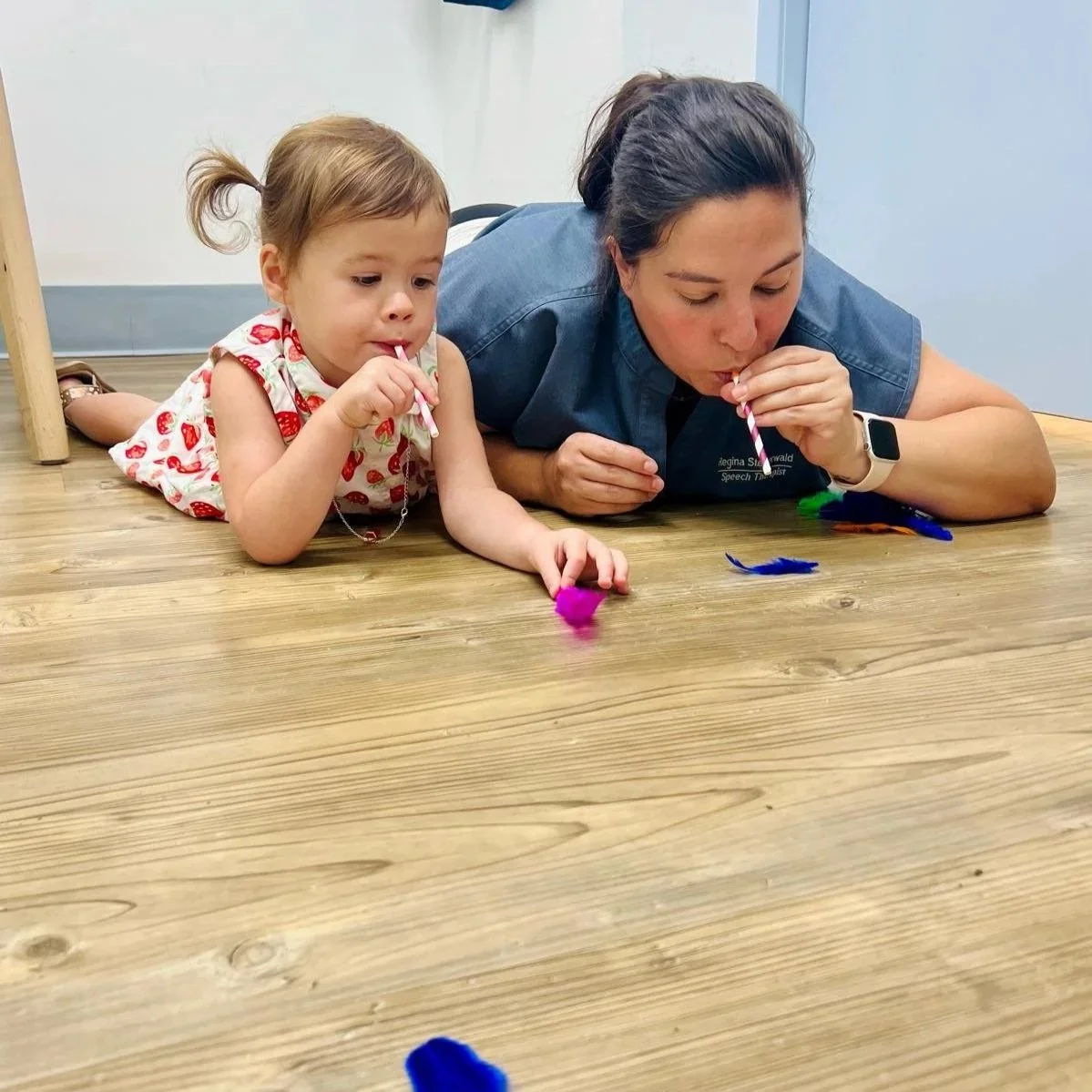 todller and therapist doing a speech therapy exercise