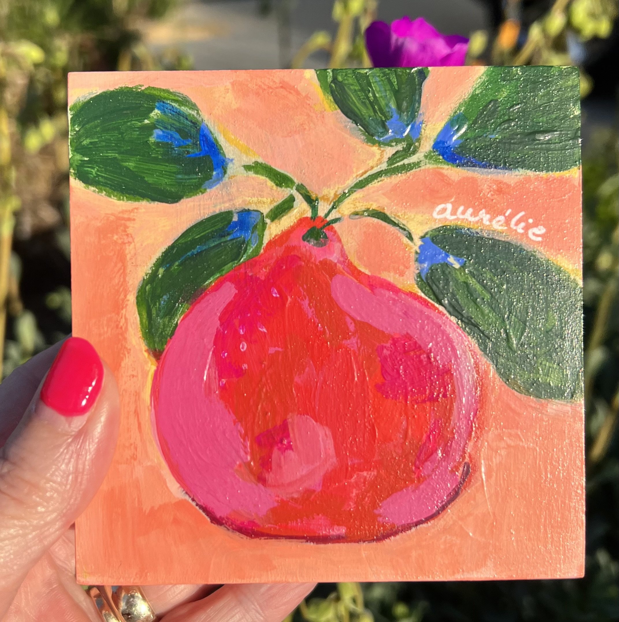 Single fruit on coral background, food waste resistance, piece de la resistance, red fruit