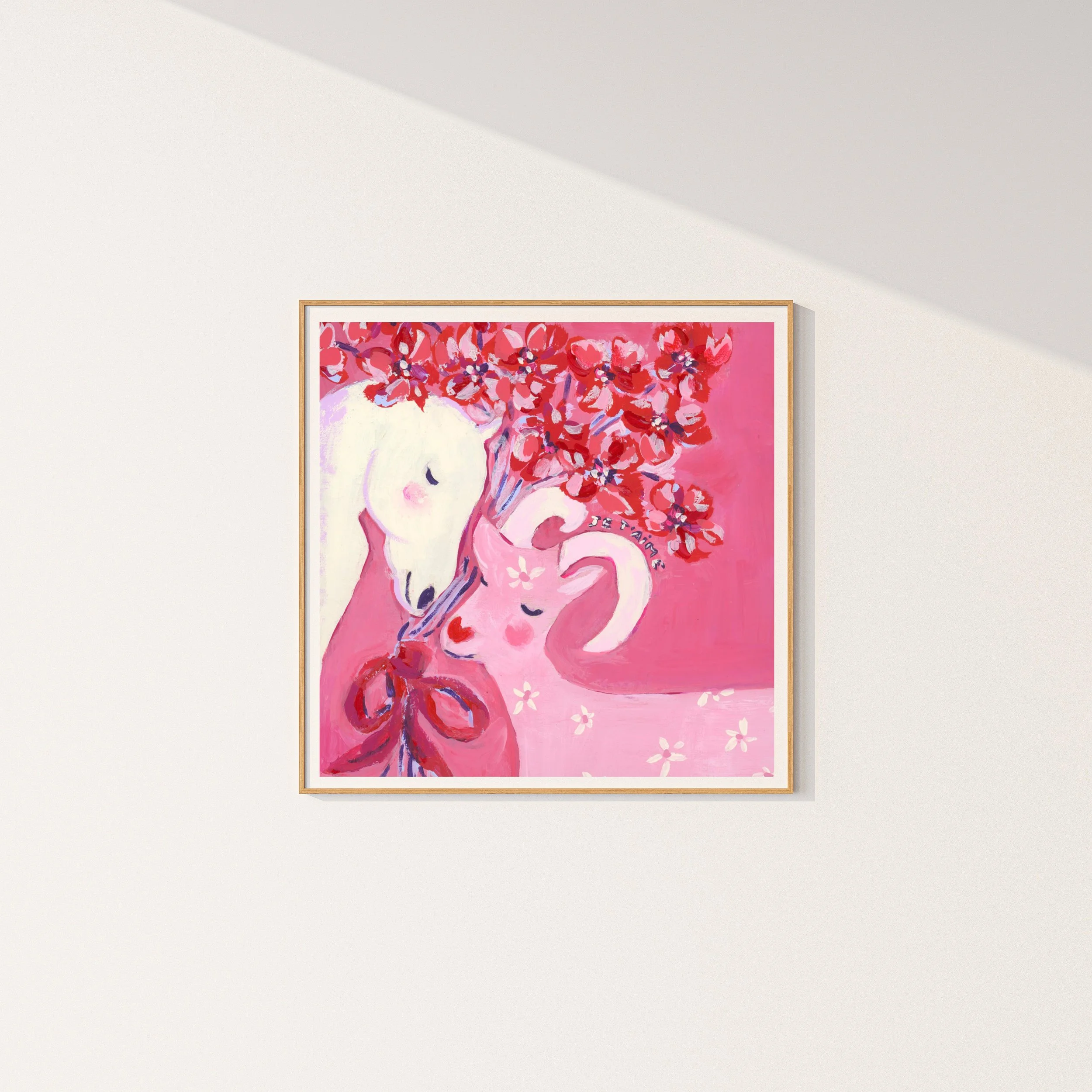Je t'aime fine art print in simple frame. A white horse and pink goat in tender embrace, crowned with red blossoms. Created for the Lunar New Year.