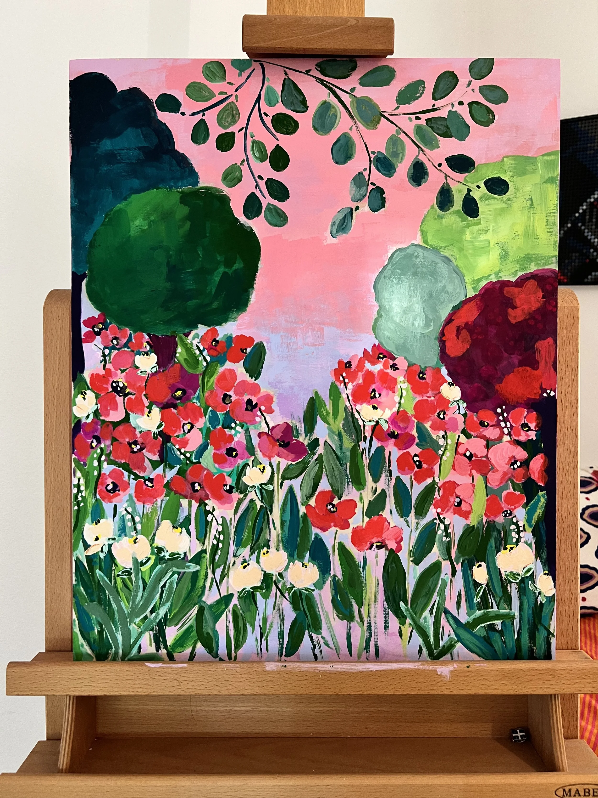 Vibrant painting capturing the enchanting beauty of Claude Monet's garden in Giverny, where brilliant red poppies bloom beneath graceful branches against a dreamy pink sky.