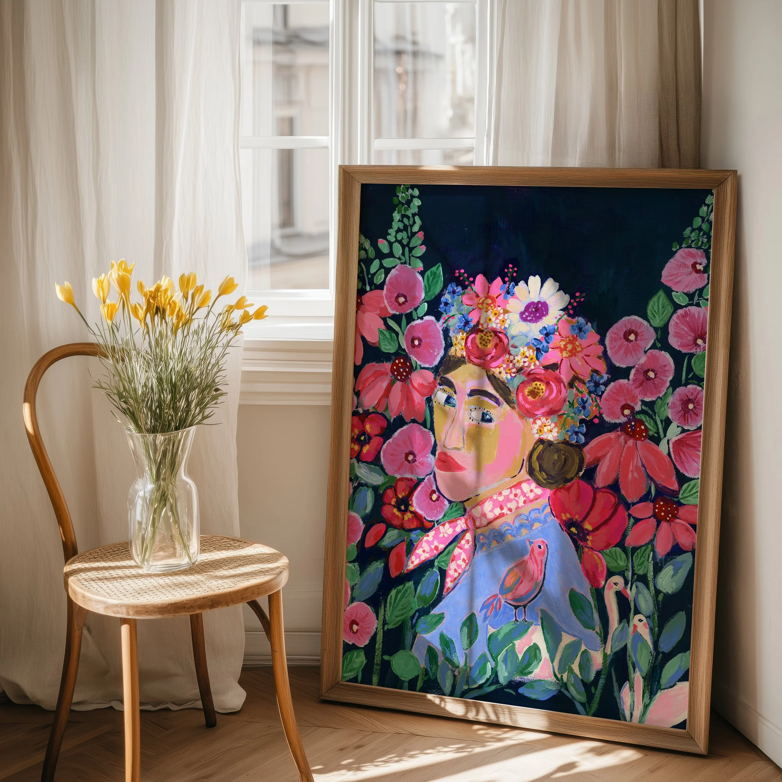 My Frida — a fine art print in simple frame, with a lovely women looking at you. She is wearing a flower crown and surrounded but lush flowers and darling animals like 2 swans and a birds.