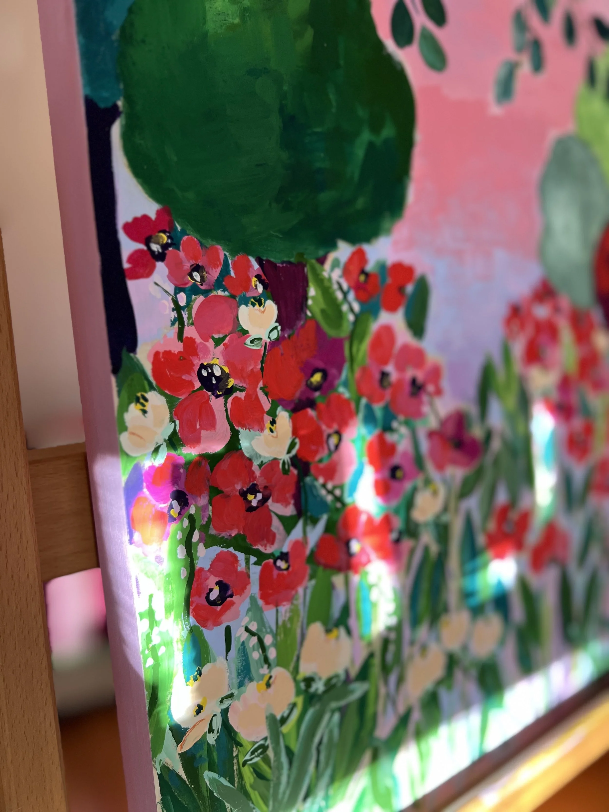 Vibrant painting capturing the enchanting beauty of Claude Monet's garden in Giverny, where brilliant red poppies bloom beneath graceful branches against a dreamy pink sky.