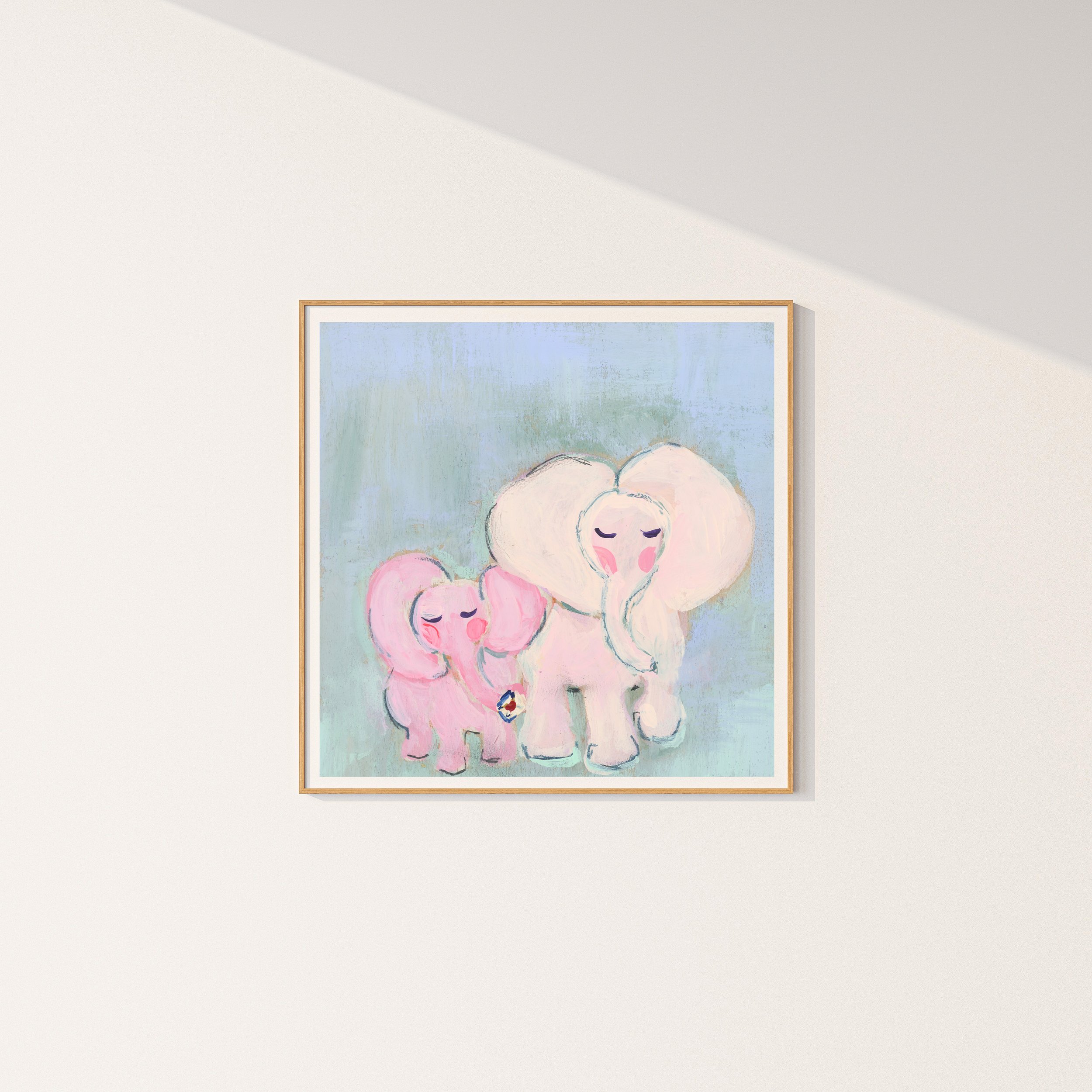 Fine Art Print in simple frame. Together Always, is a tender elephant duo painted in the softest pinks and mints to bring peace and serenity with this petite artwork.