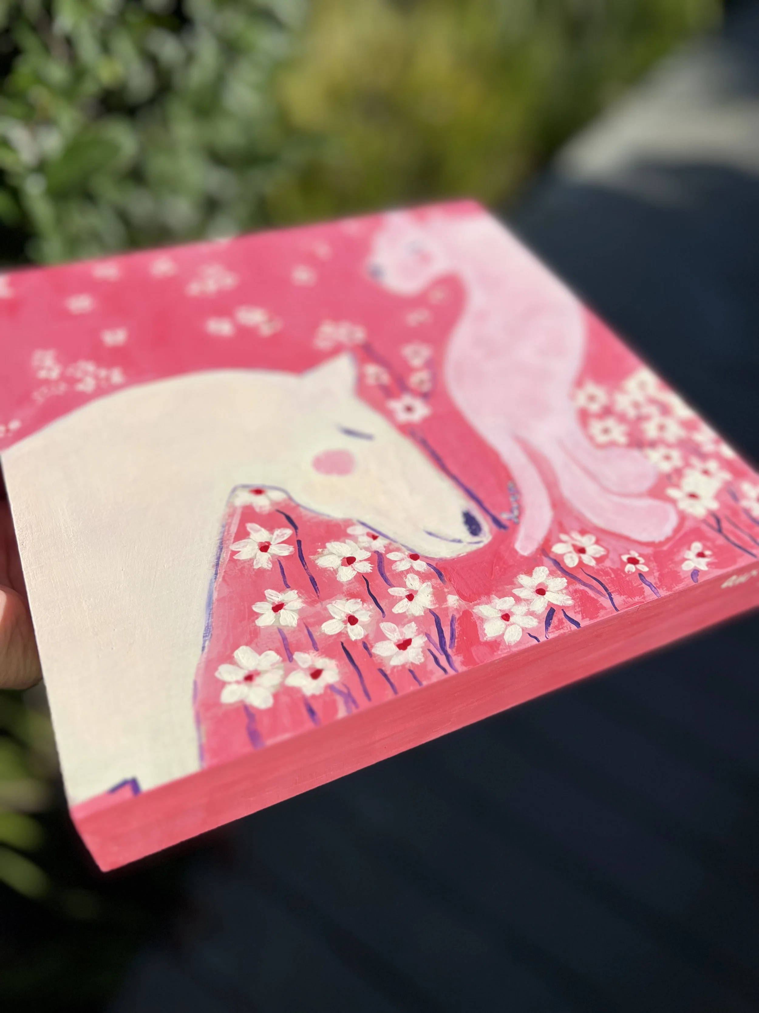 Love Ya. Original artwork. A white horse and pink tiger embracing floating white flowers. Created for the Lunar New Year to celebrate love's ability to transcend all boundaries.