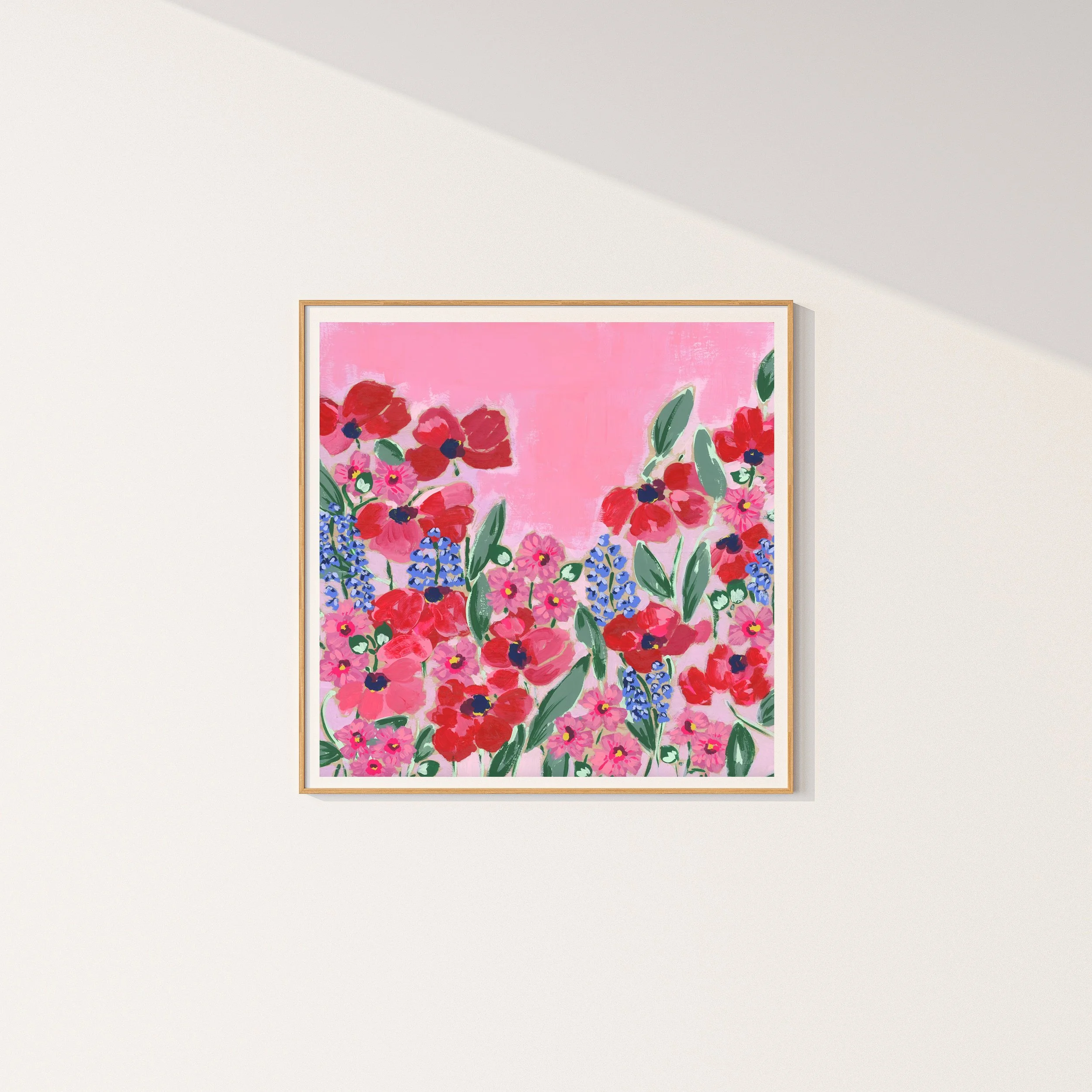 Fine art print with vibrant red and pink poppies, blue delphinium spikes, and cosmos flowers against a soft rose-colored background, inspired by Monet's Giverny garden.