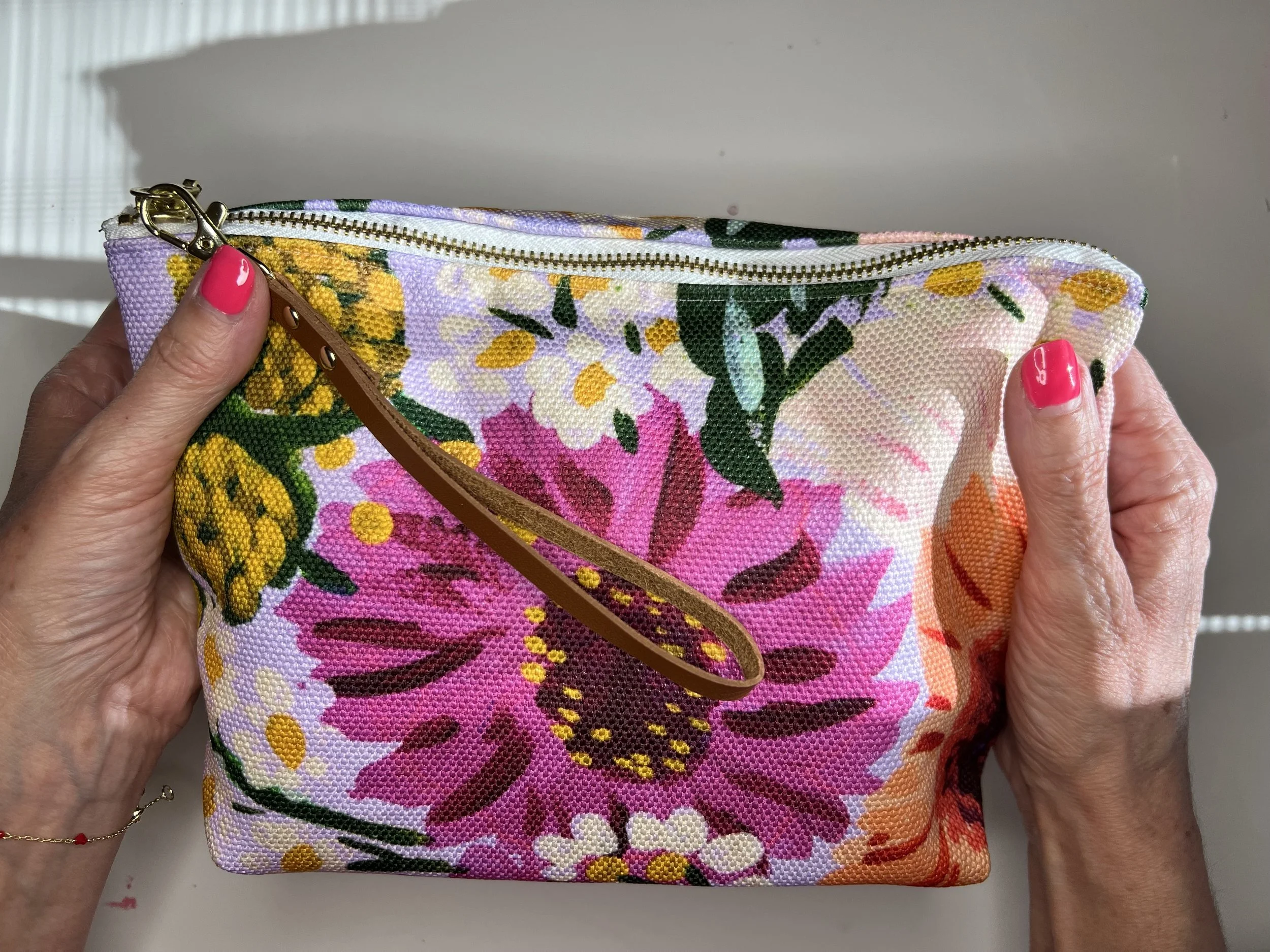 Vibrant color zipper pouch with unique and original art by Aurelie Brown. Made with durable poly canvas to sort your belongings. Ideal for make-up, tech accessories or paint supplies!