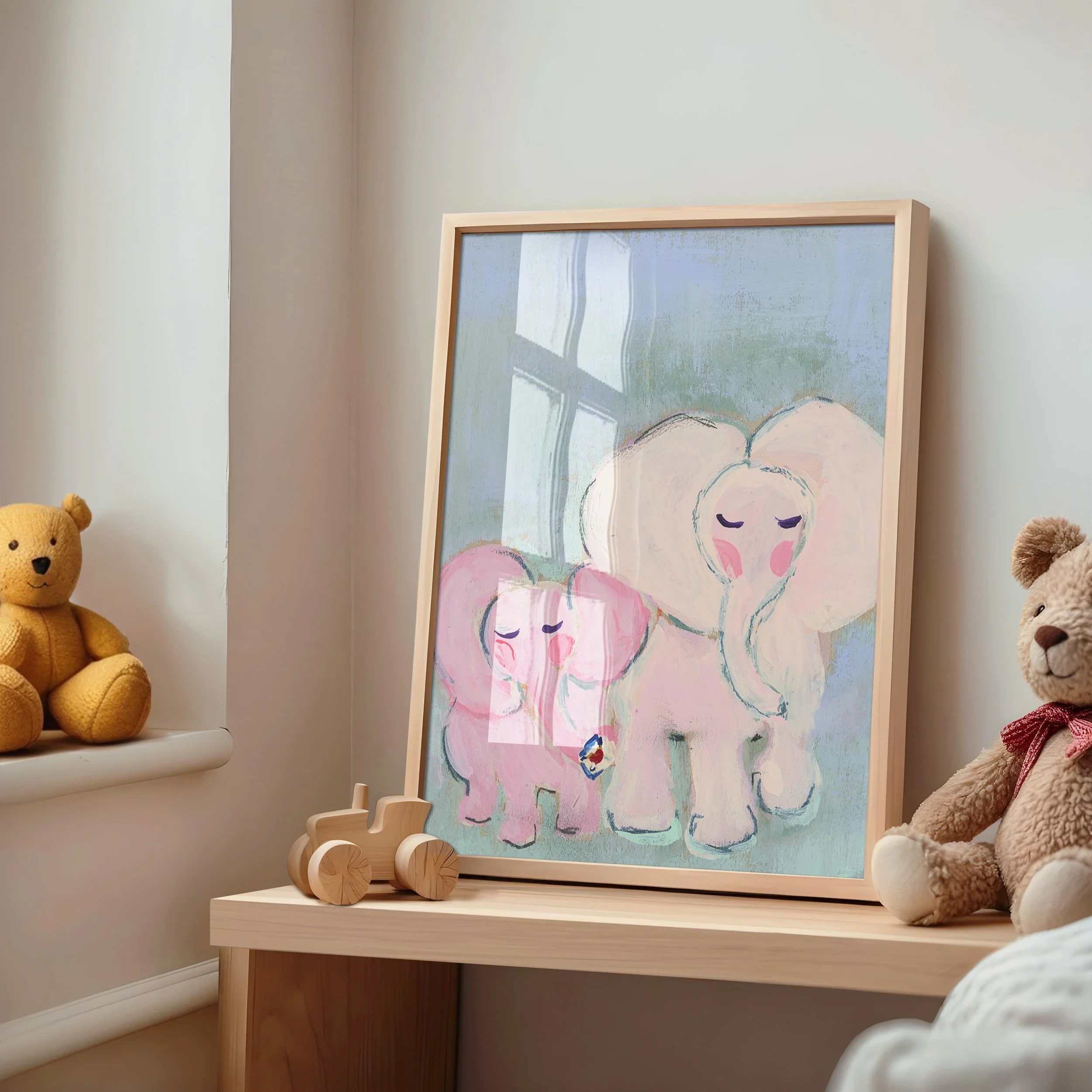 Fine Art Print in simple frame in a nursery. Together Always, is a tender elephant duo painted in the softest pinks and mints to bring peace and serenity with this petite artwork.
