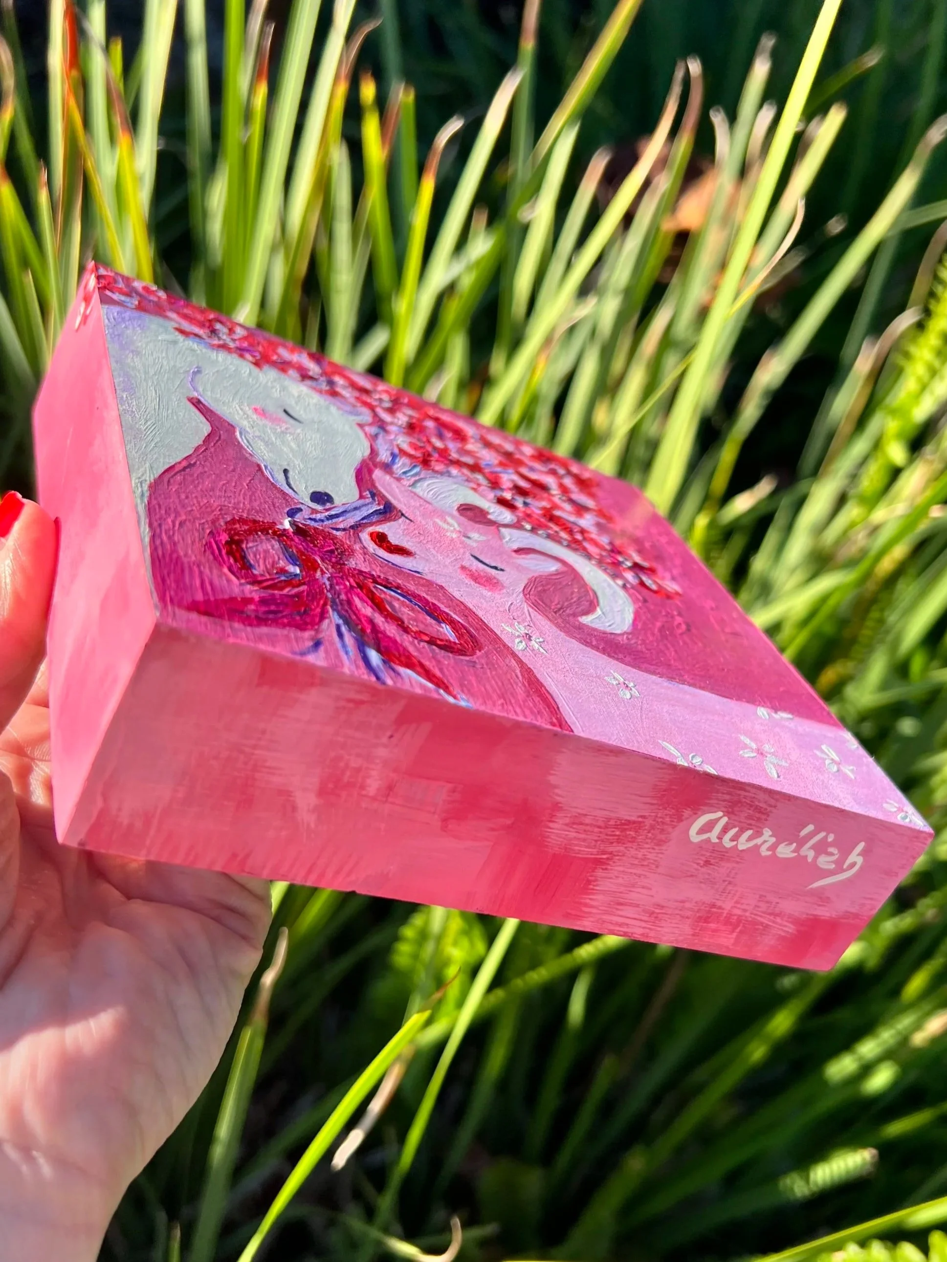 Je t'aime Original artwork. A white horse and pink goat in tender embrace, crowned with red blossoms. Created for the Lunar New Year to celebrate love's ability to transcend all boundaries.