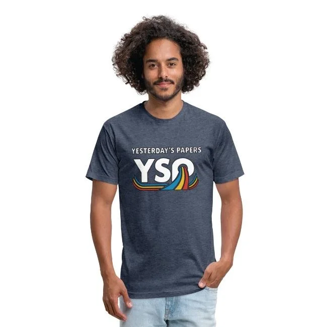 Man wearing a heather navy blue premium cotton t-shirt with the Yesterdays Papers 90s cover band classic retro logo in bold white text and primary color ribbons.