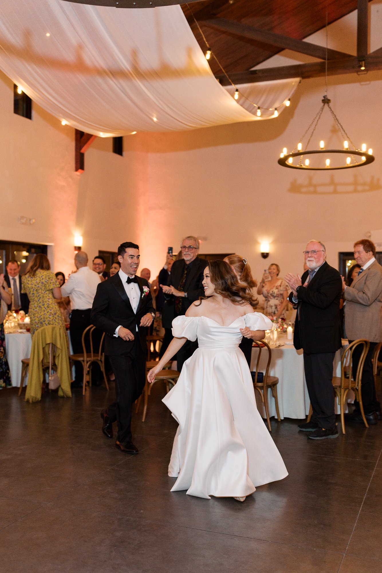 grand entrance at sonoma winery wedding with elevated details and drapery