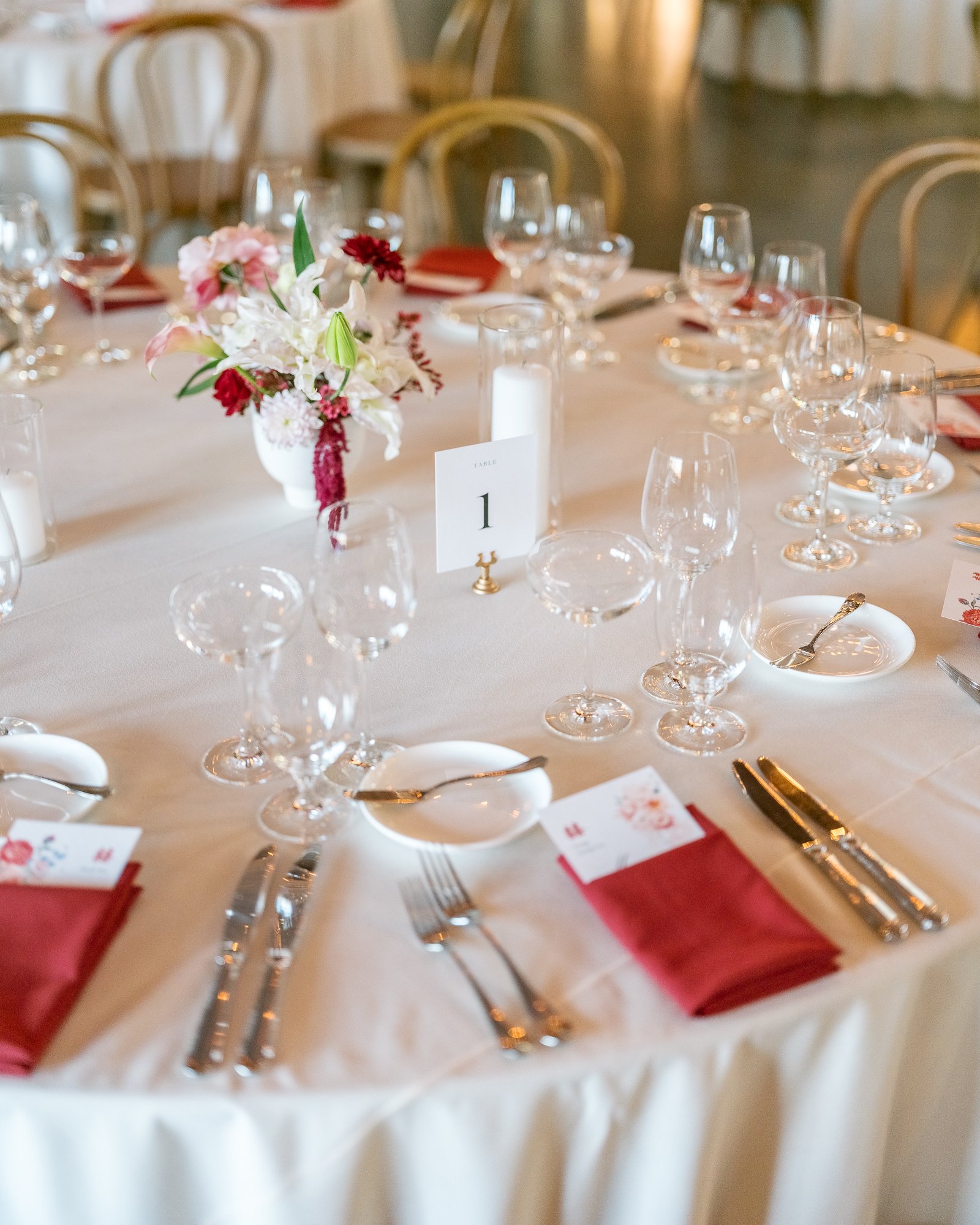 deep red floral palette reception details at sonoma winery wedding