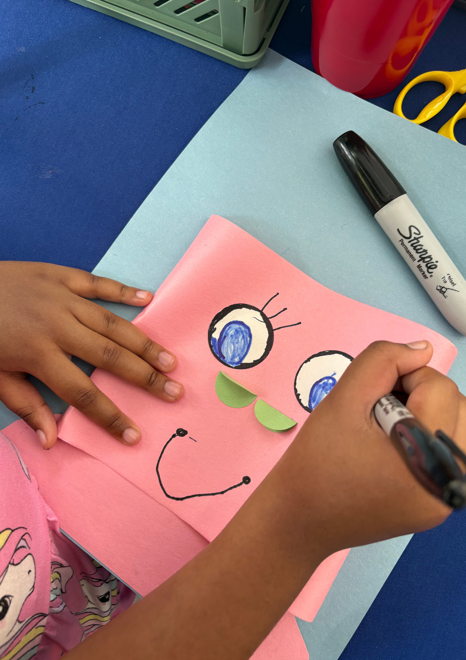Participant creating artwork at our CYS x NYC DOT Summer Streets art station