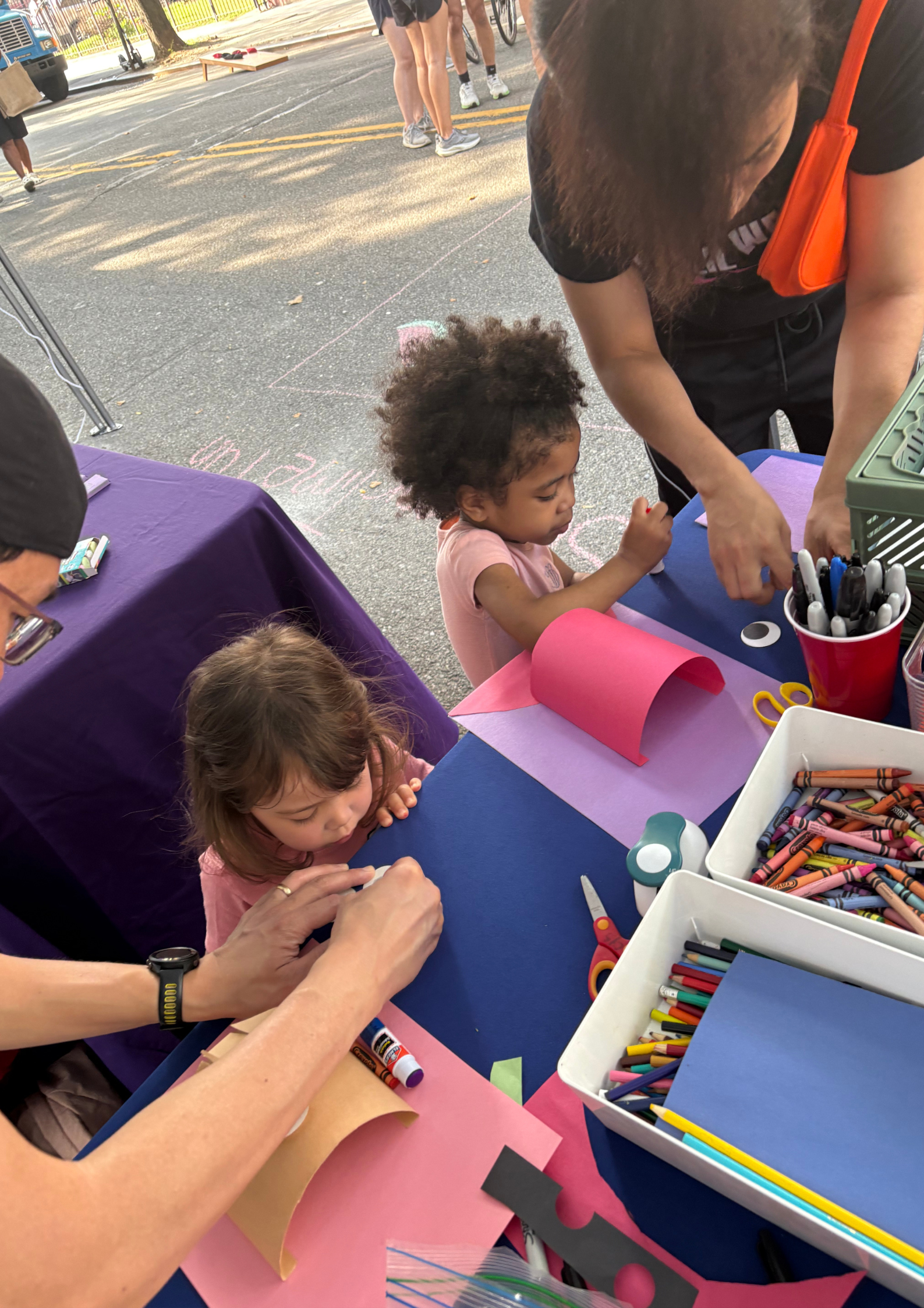 Participants creating artwork at our CYS x NYC DOT Summer Streets art station