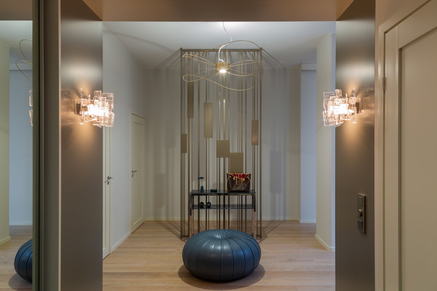 Discover the artistry of the Colonna space divider, designed by Carola Rytsölä, which provides subtle separation while inviting light to flow freely through your interiors from the Fleming Collection.