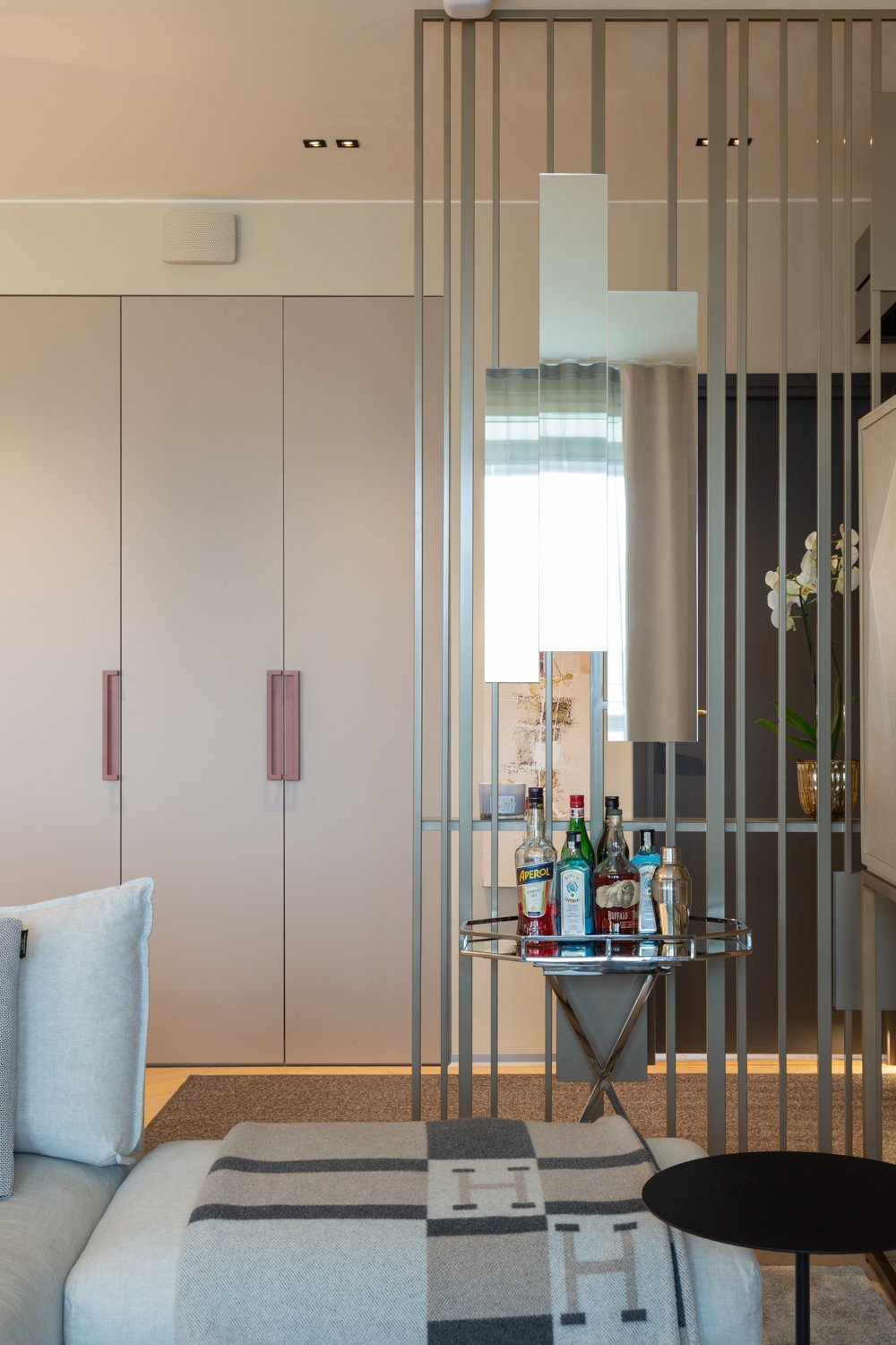 Carola Rytsölä's Colonna space divider is not just functional but a statement piece that adds height and sophistication to any space, making it an essential part of the Fleming Collection.