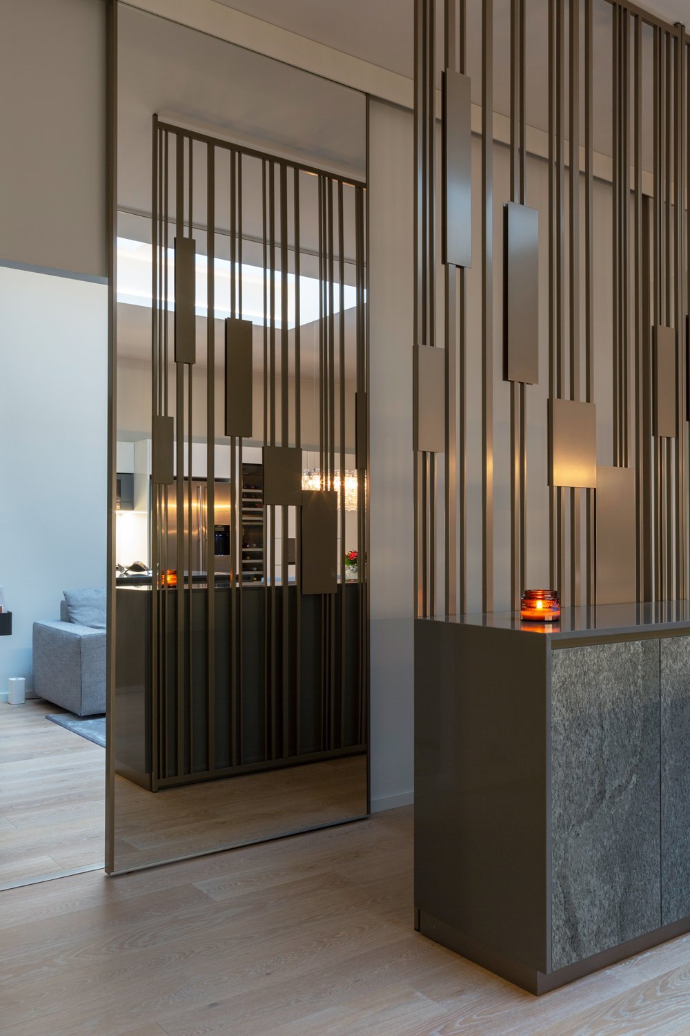 Carola Rytsölä's Colonna space divider offers a refined solution for delineating areas while maintaining an open feel, beautifully embodying contemporary design from the Fleming Collection.