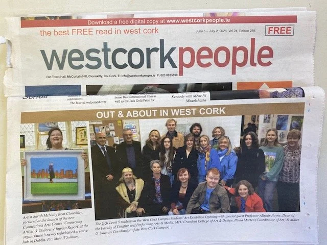 Newspaper page featuring a photo of a group of people posing for a photograph at the opening of a QQI Level 5 students' art exhibition at the West Cork Campus, with text describing the event and the individuals involved.