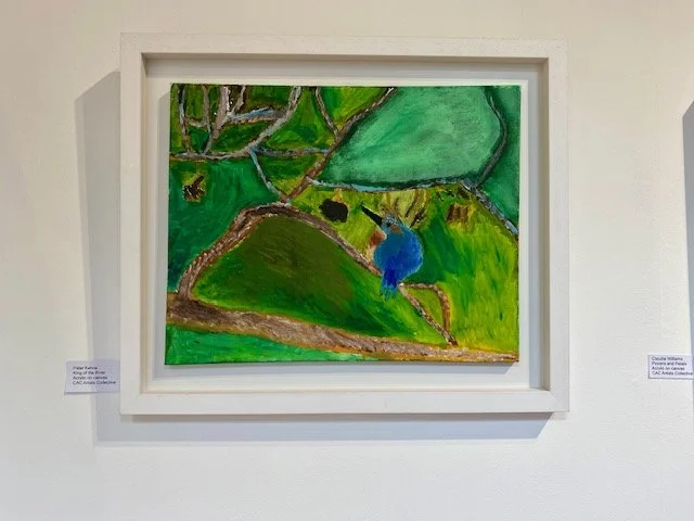 A vibrant, impressionistic painting of a bright blue kingfisher perched on a branch against a lush green background of foliage and water, framed in white.