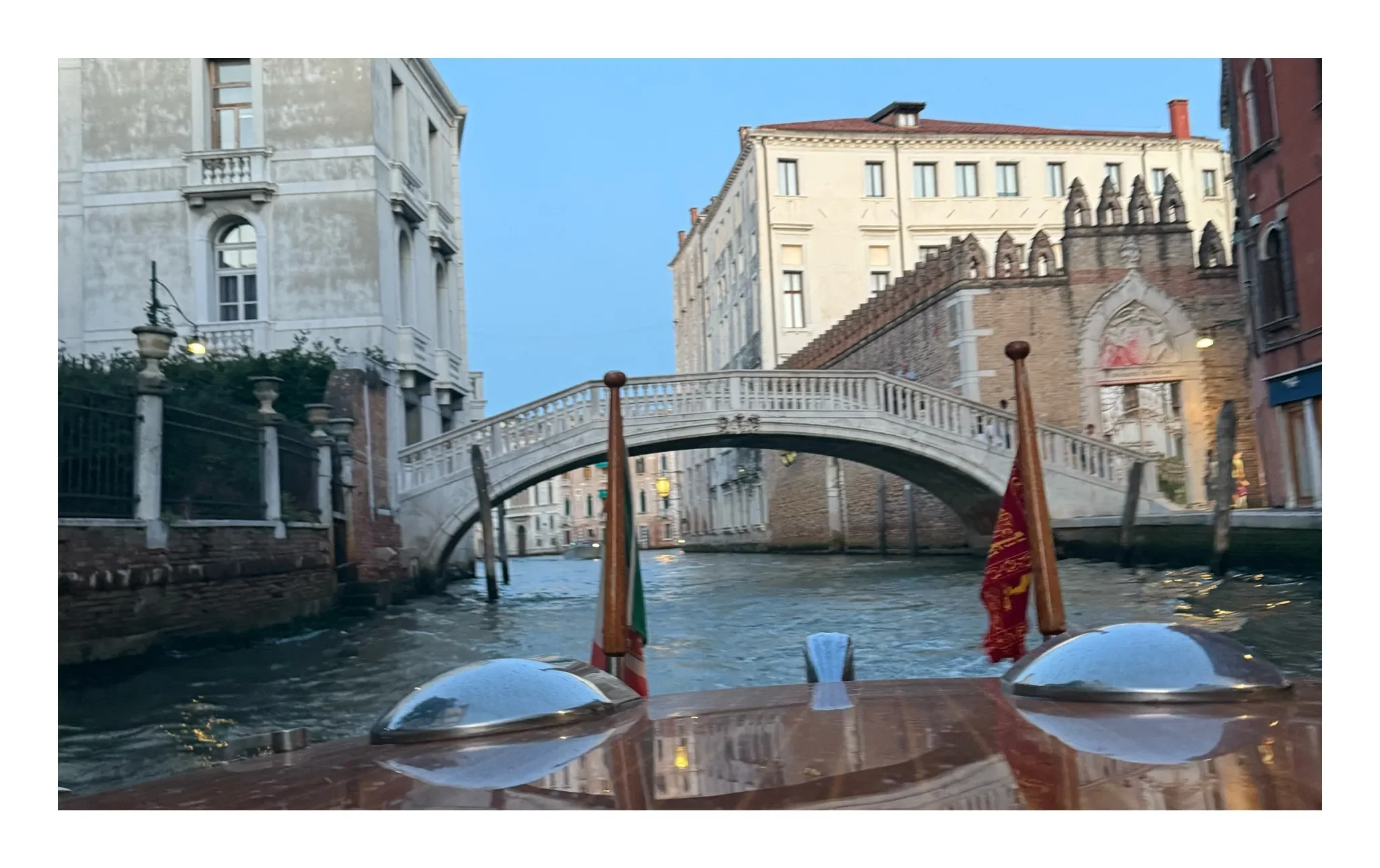Private water taxi view of a bridge in Venice, Italy—inspiration for an exclusive European tour with a professional travel companion.