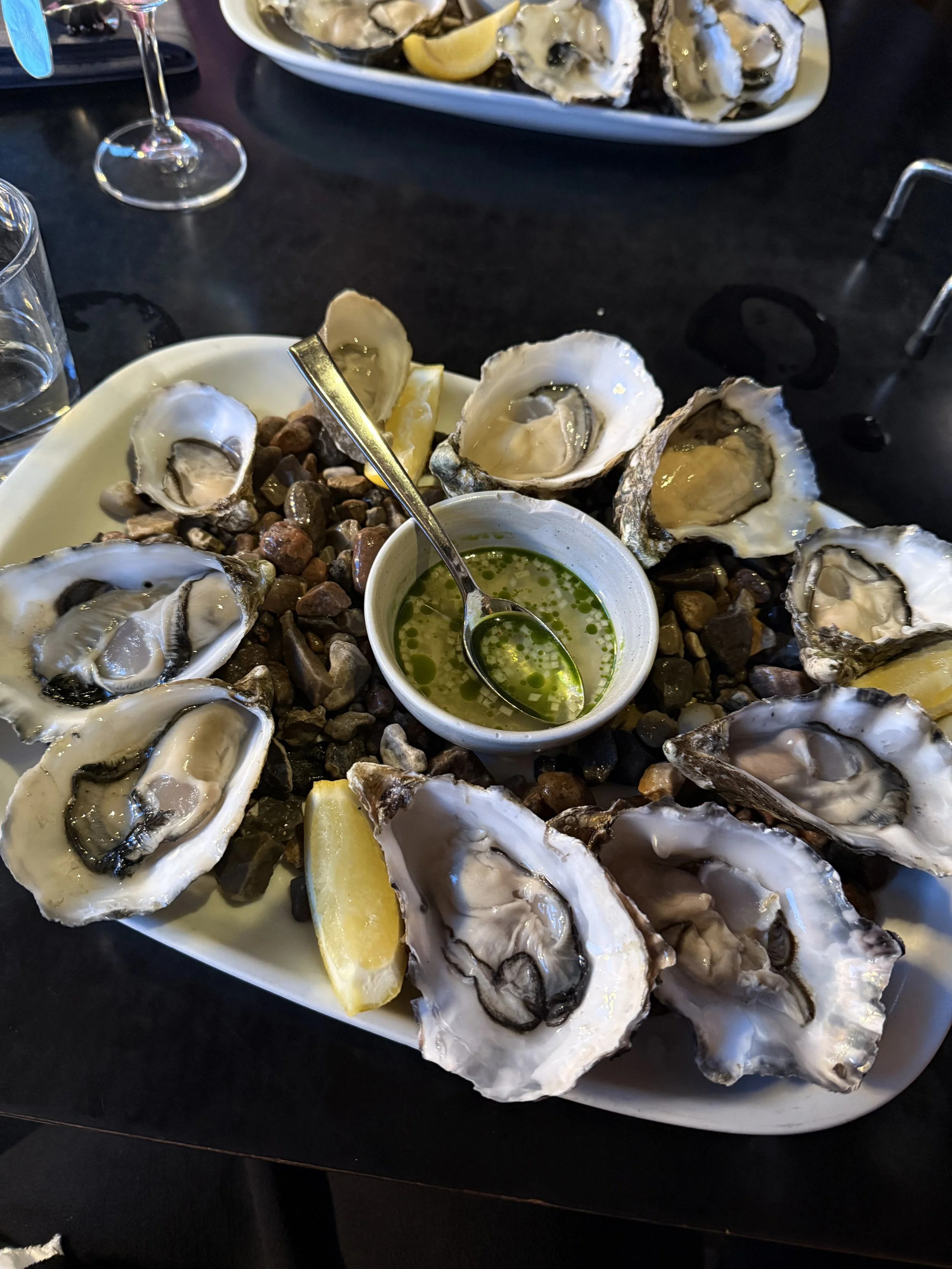 Freshly shucked oysters at Kødbyens Fiskebar in the Meatpacking District, Copenhagen—a favorite spot for seafood lovers.