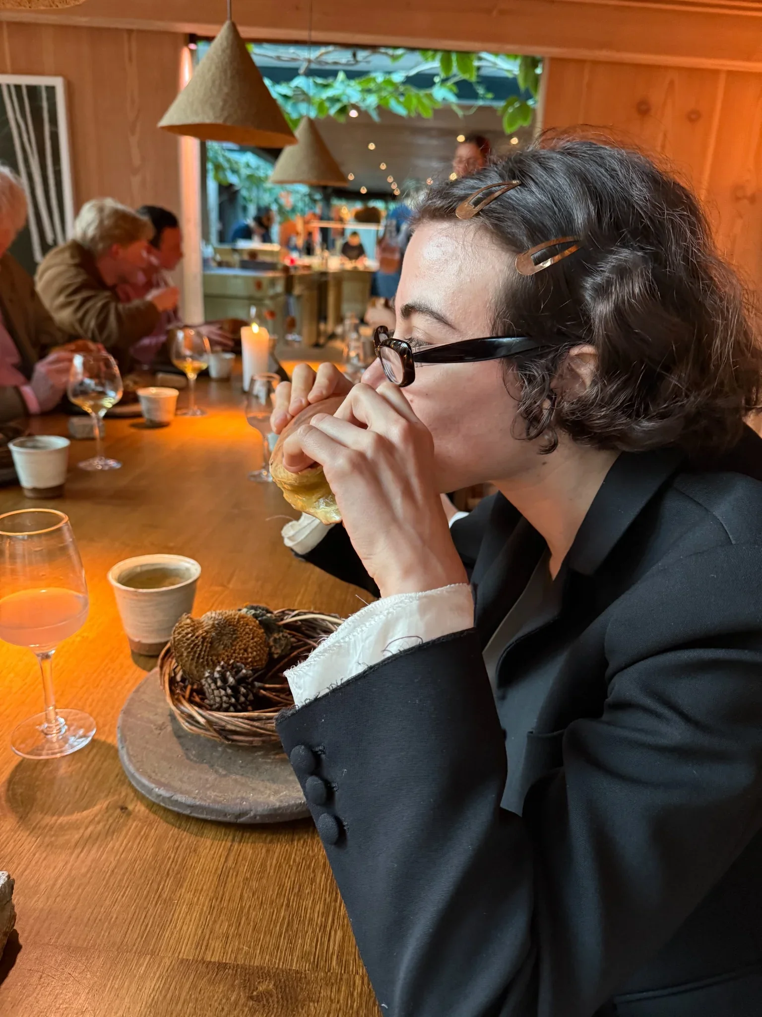 Yukikon enjoying a unique dining moment at Noma Copenhagen, drinking soup from a crab shell during the Ocean Season.