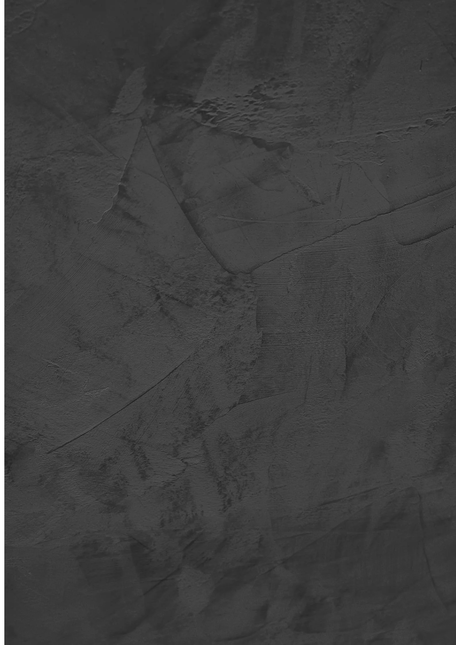 Close-up of a textured dark gray concrete or cement wall surface.