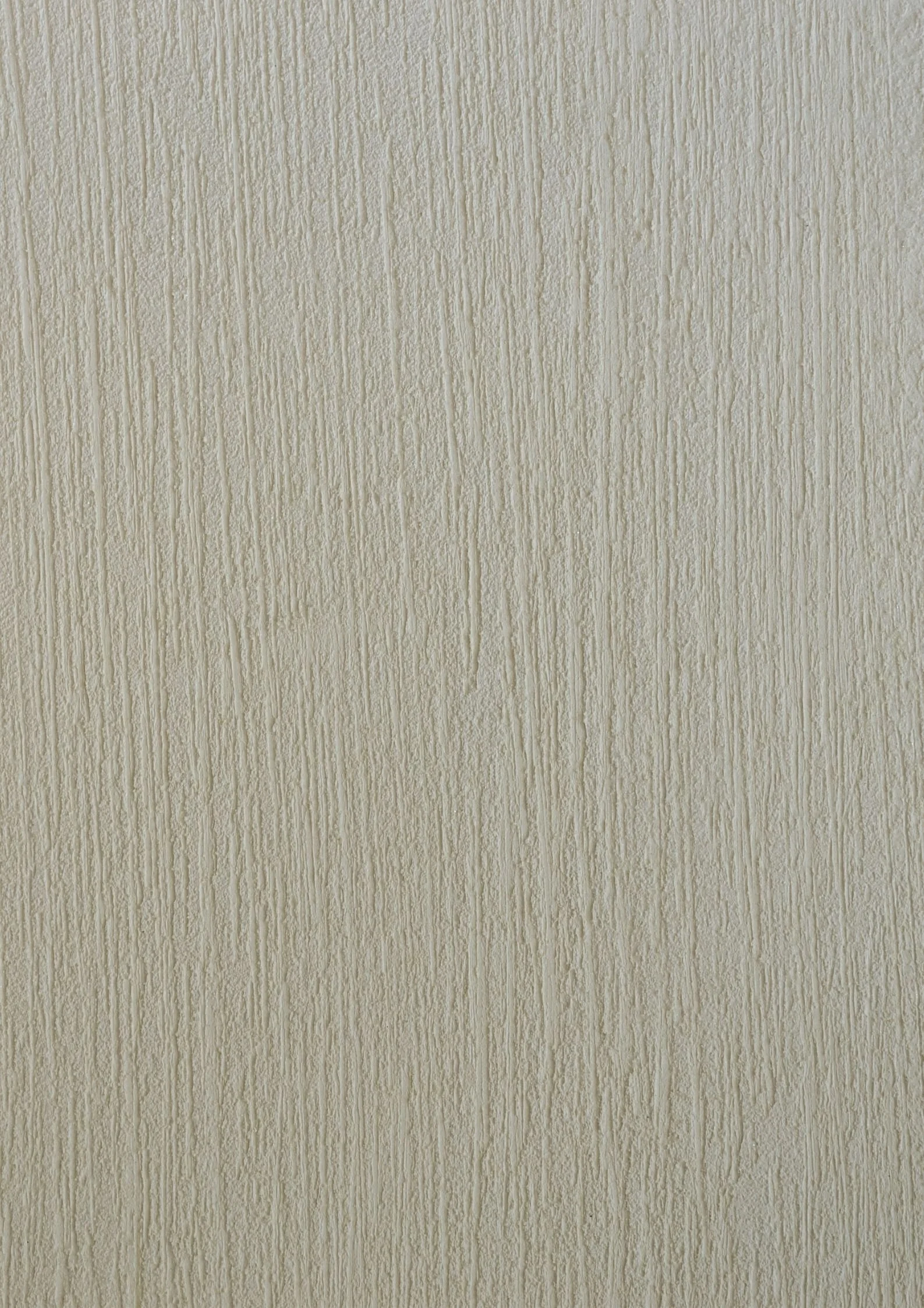 Close-up of a beige textured wall with vertical lines.