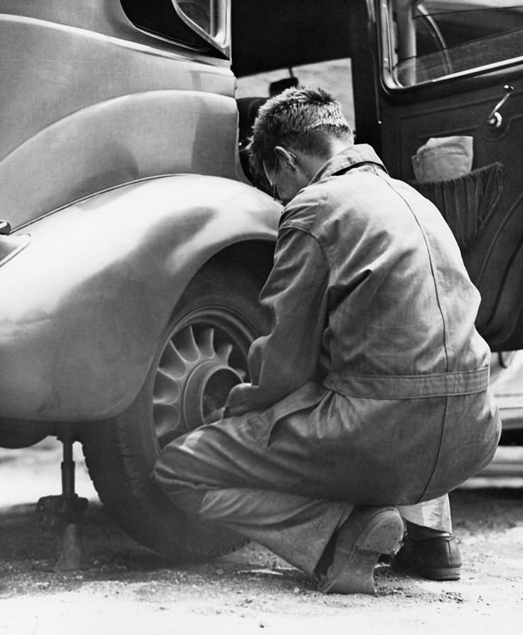 Mechanic Changing Tire On Car by George Marks.jpeg