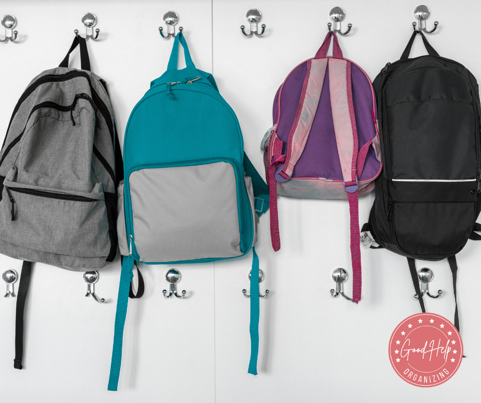 Four backpacks lined up for a regular backpack paper check.