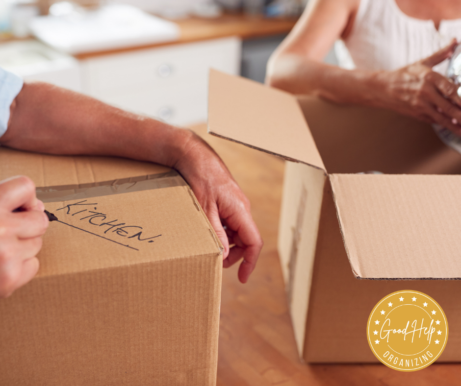Organizers packing kitchen stuff for downsizing