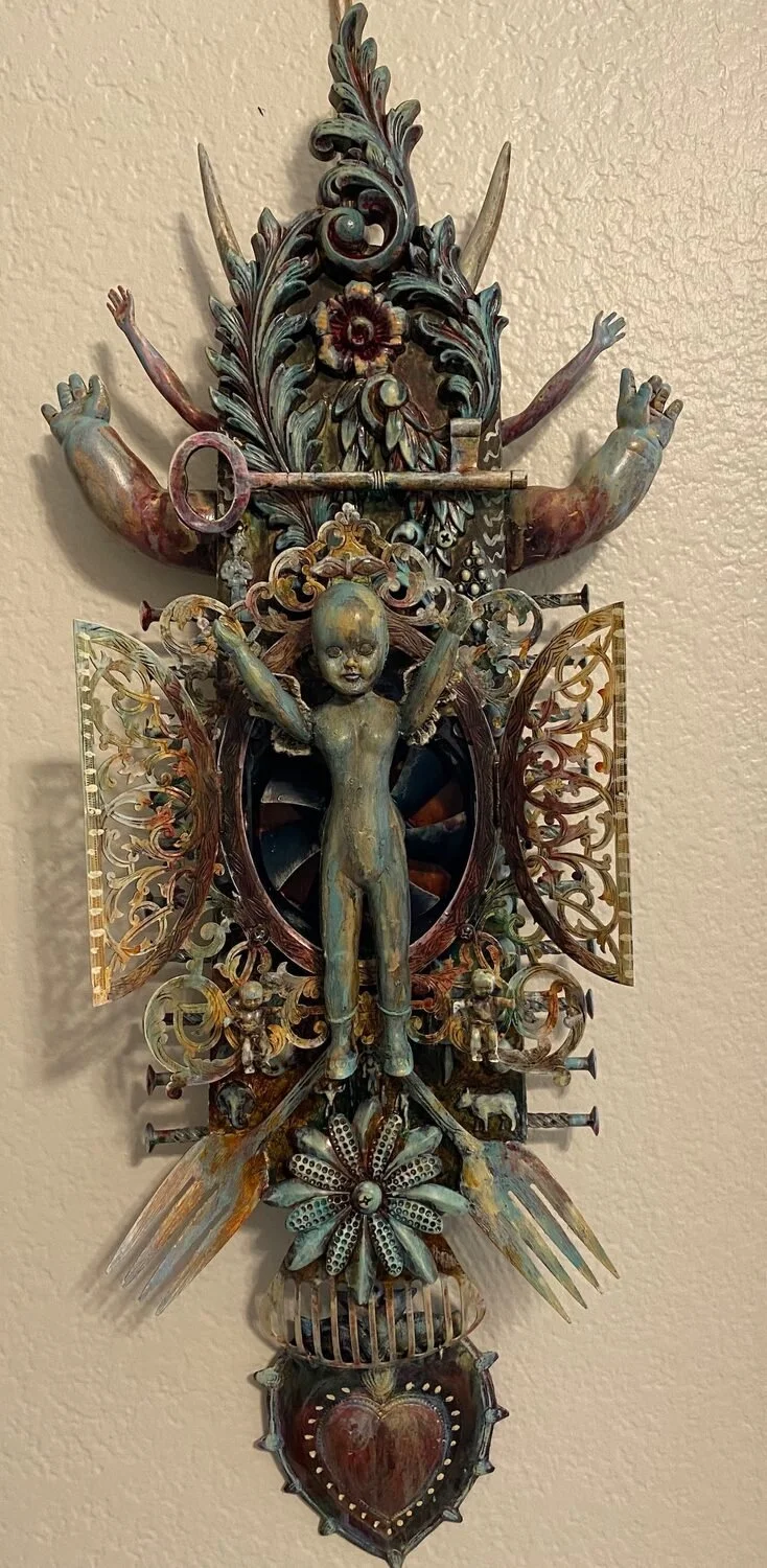 Karla Ann Cloninger 
Sculpture 
28 x 10 x 5 
$800 
Found objects screwed, wired and glued to a fan blade support, then pained with acrylic washes. • karlacloninger1@gmail.com