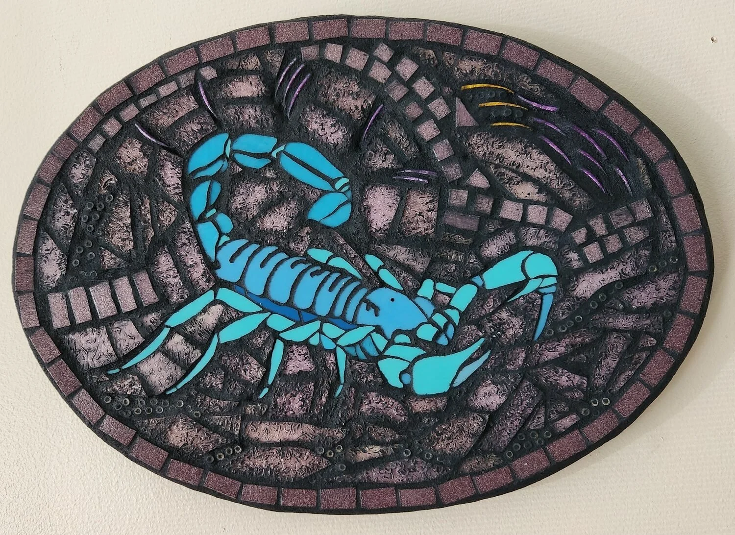 "Blue Scorpion Spirit Message - Embrace Change" by Amelia Williams
6 x 12 Mixed Media
NFS

Mosaic: Art glass, sea spines, beads on handcrafted substrate
During a major life change I nearly stepped on a scorpion with my barefoot. I welcomed this close