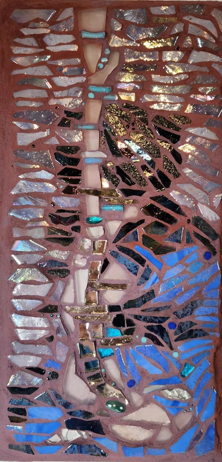 "Strata: Melt ... Release" by Amelia Williams
12 x 6 Mixed Media
$350

Mosaic: Vitreous glass tile – matte and iridized, frosted glass, mirror and beads
Resting for awhile in the confines of structure, ice melts and is eventually released to a new st