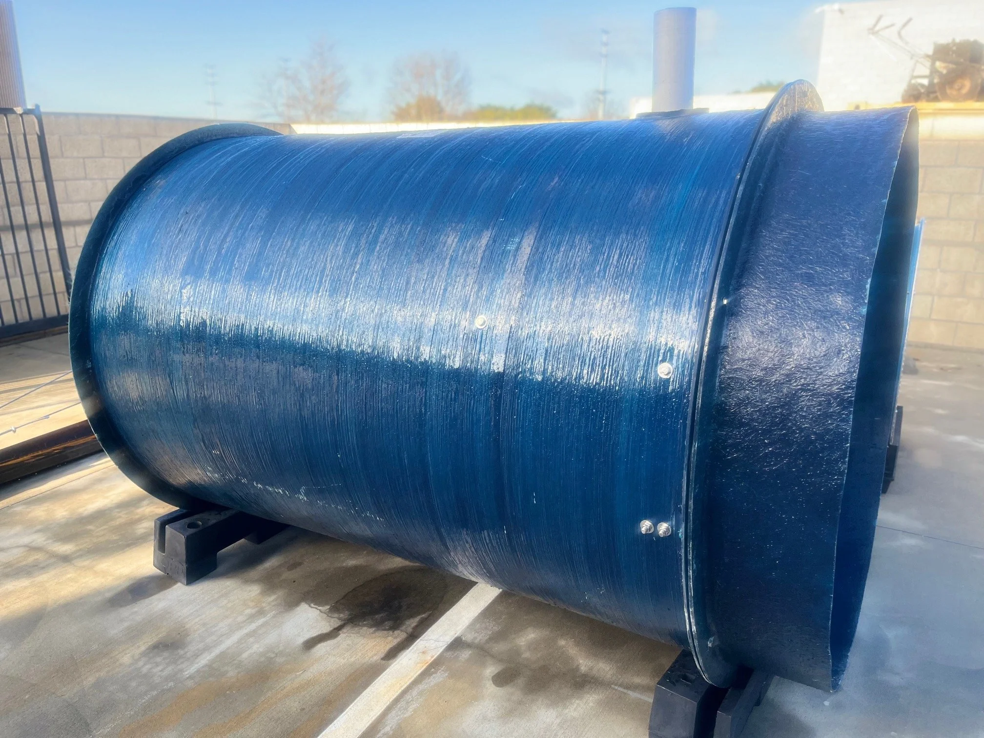 Fiberglass wet well structure with reinforced flange