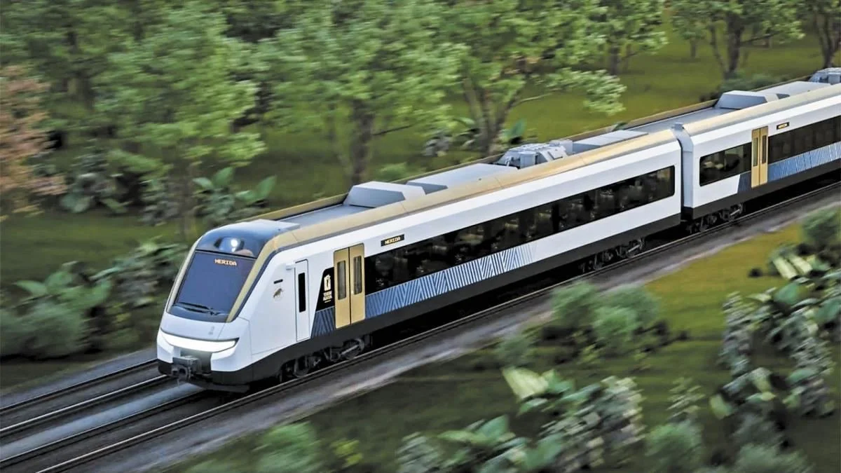 Tren Maya passenger train travelling through forest, showing Mexico's newest generation of electric multiple-unit rolling stock
