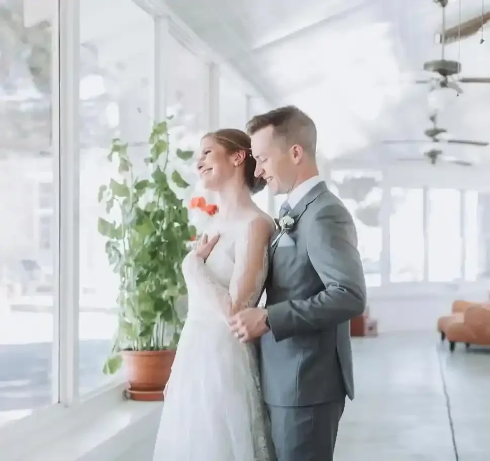 Newlyweds enjoy one another's company in the sun room after a beautiful wedding at Hotel Limpia in Fort Davis, Texas.