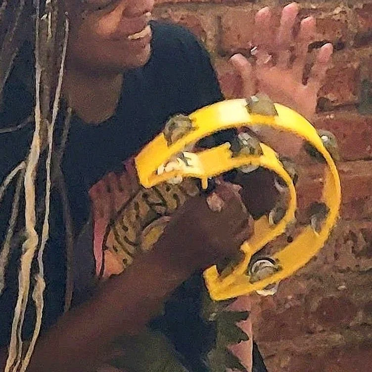 Girlyellow tambourine.jpg