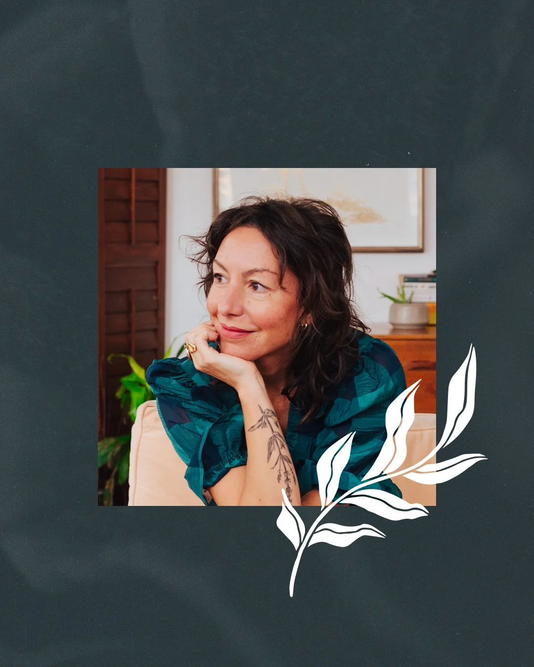 A woman with dark curly hair, wearing a teal blouse, sitting indoors with her chin resting on her hand, looking off to the side with a gentle smile. There is a plant, picture frame, and wooden furniture in the background, with a white illustrated leaf design overlay.