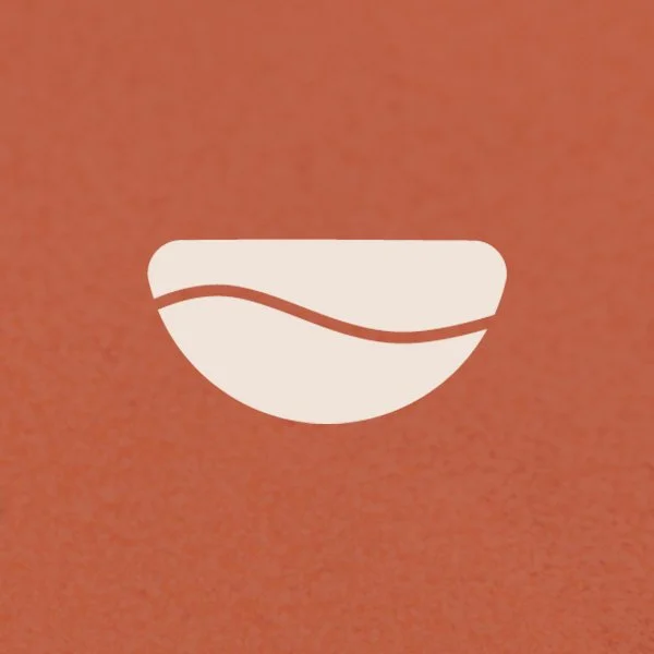 A white icon of a bowl with a spoon on an orange background.