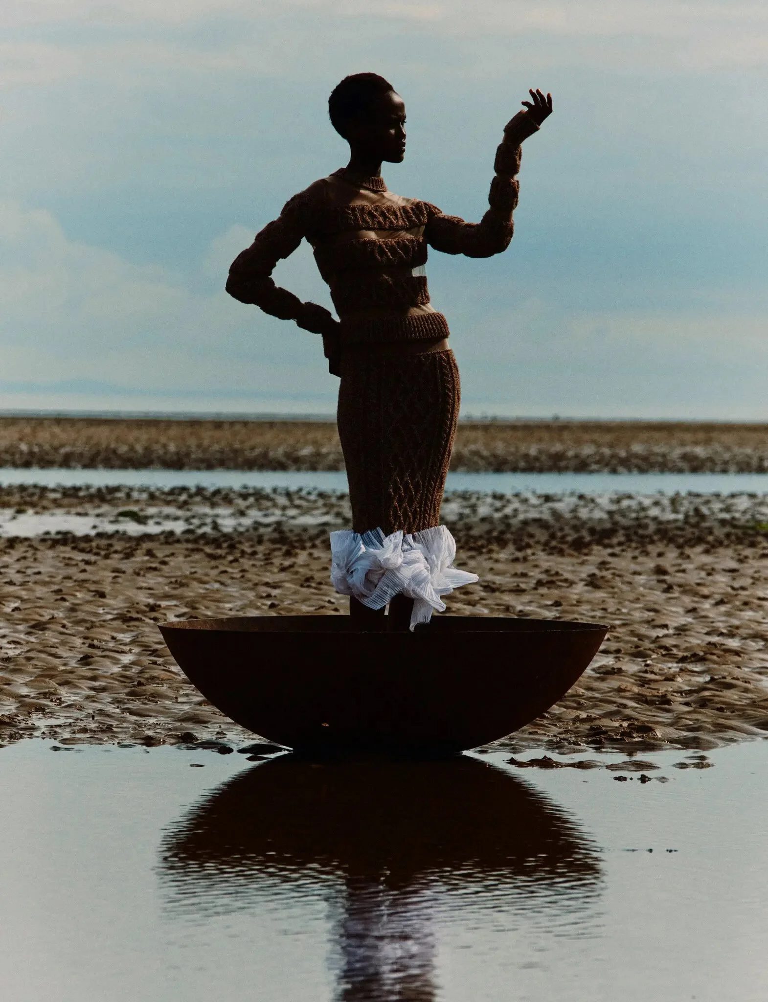 Abstract composition shot on a Scottish beach by Jack Davison for T: The  New York Times Style Magazine 

Model wears Schiaparelli sweater and skirt, and stylist’s own skirt (worn underneath).

Styled by Raphael Hirsch.
Local Production and Locations