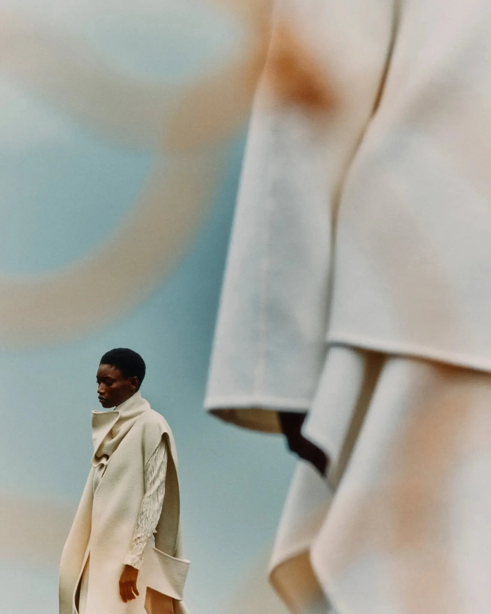 Photographed in Scotland by Jack Davison for T: The  New York Times Style Magazine. 

From left: Sportmax coat and Phoebe English top (worn underneath). Alaïa coat and skirt, maison-alaia.com
Credit: Photograph by Jack Davison. 
Styled by Raphael Hir