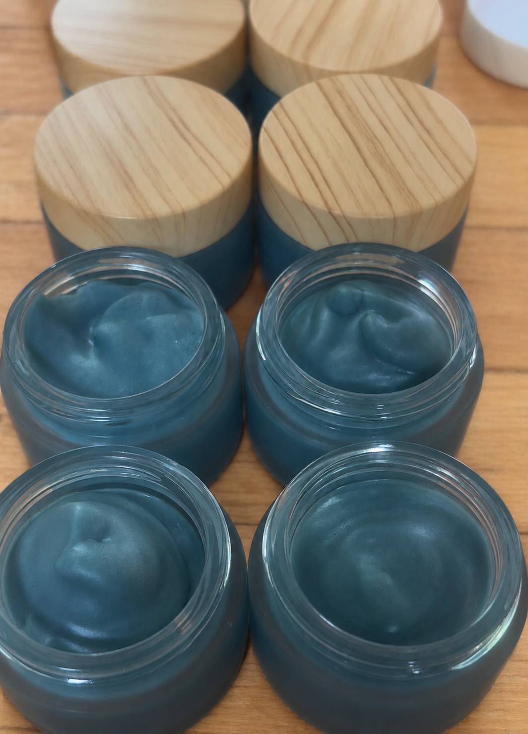 Blue Cream Jars on Light Wood.png