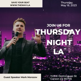 A man in a black jacket speaking into a microphone in front of a city skyline at night with purple and pink lights, promoting an event for Thursday night in LA on May 18, 2023.