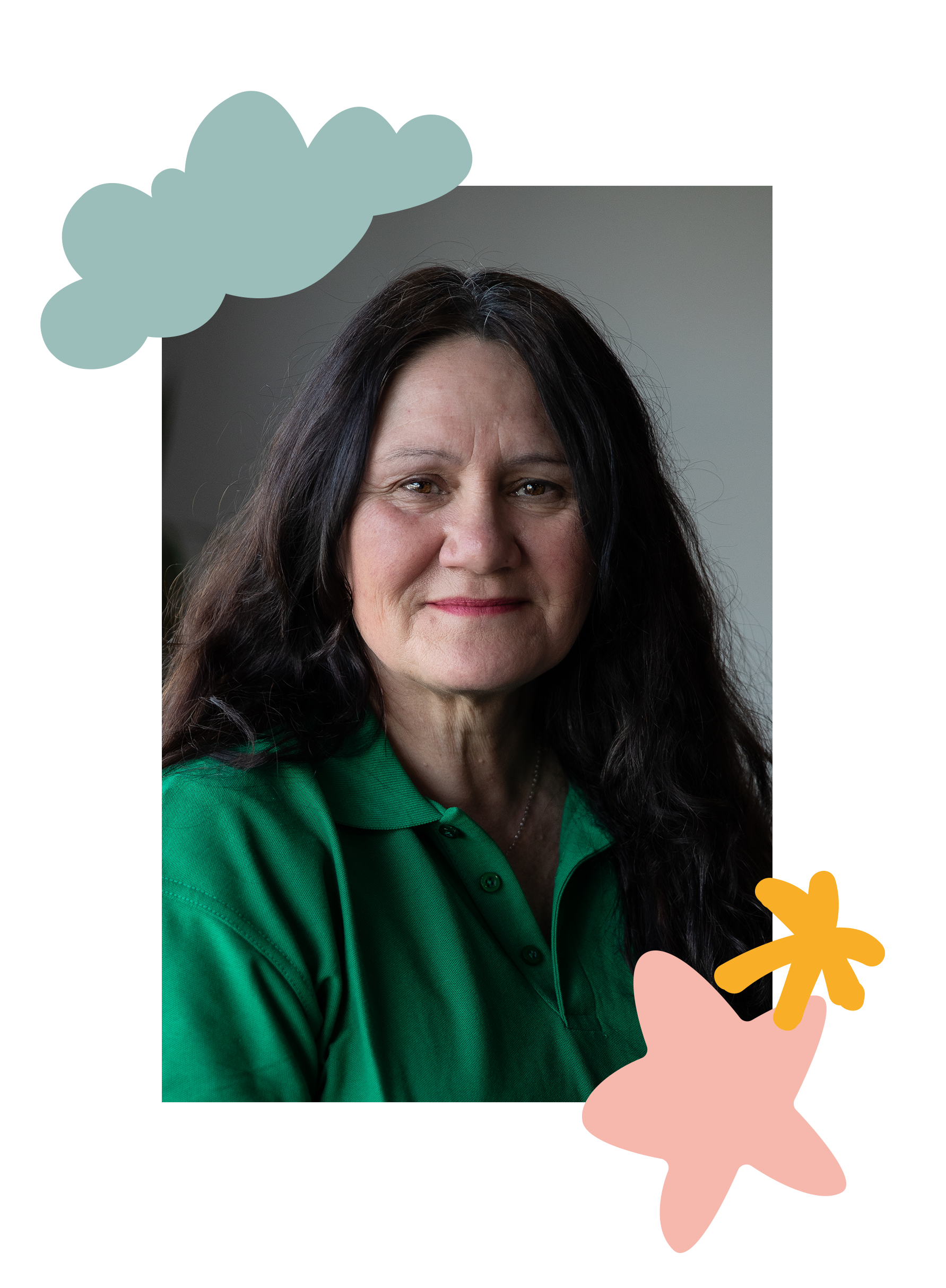 A middle-aged woman with long dark hair, wearing a green polo shirt, looking at the camera with a slight smile.
