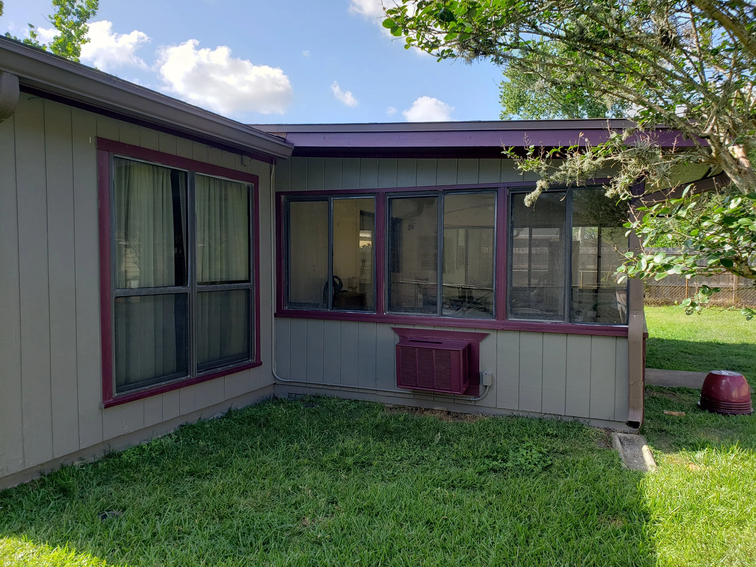 Picture of the left side of the Florida room. We painted the outside of old AC window unit the same as the trim color really came out great.